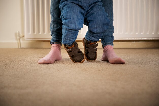 Kid and parent walking indoors