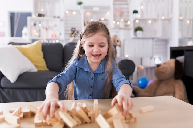 Free photo kid playing in living room