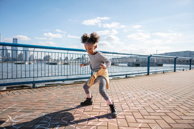 Kid playing outdoorns in the park