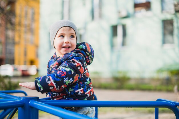 Kid playing outside on playground