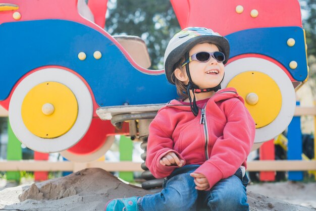 Kid playing outside on playground