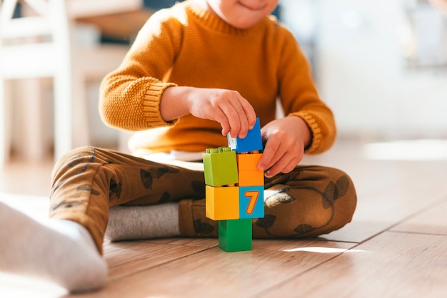 Kid playing with cubes