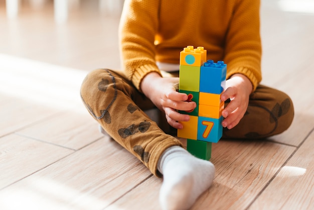 Kid playing with cubes