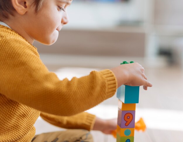 Kid playing with cubes