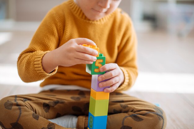 Kid playing with cubes