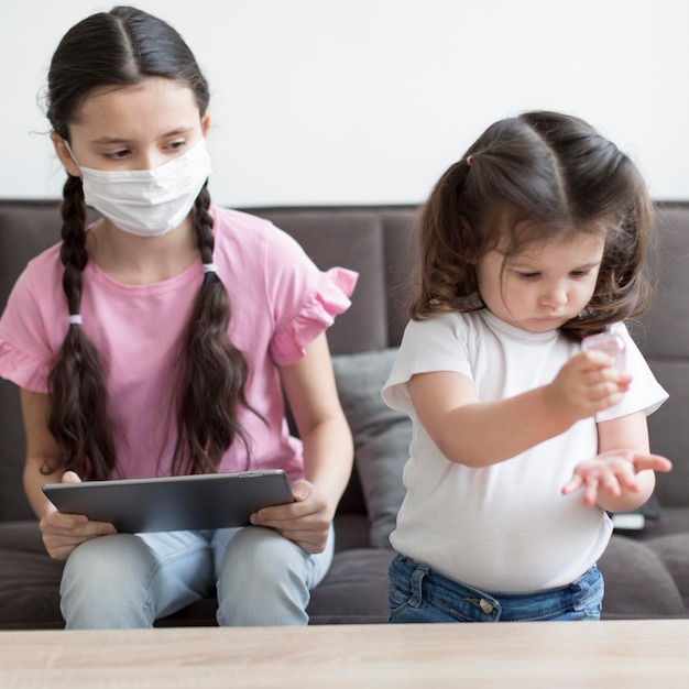 Free photo kid pouring disinfectant