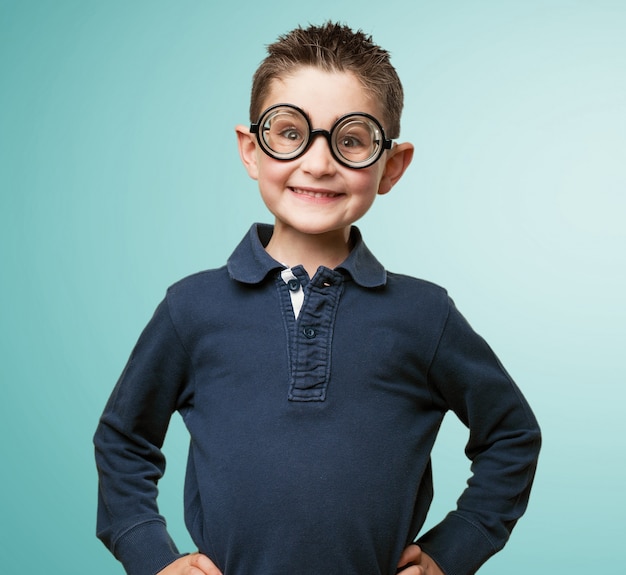 Kid smiling with a glasses