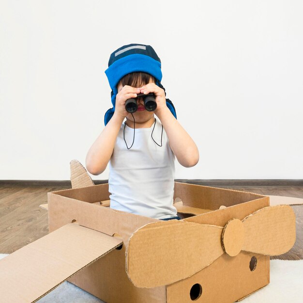 Kid watching through binocular