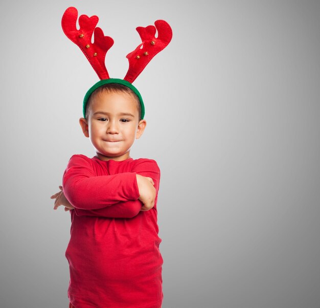 Kid with plush reindeer antlers