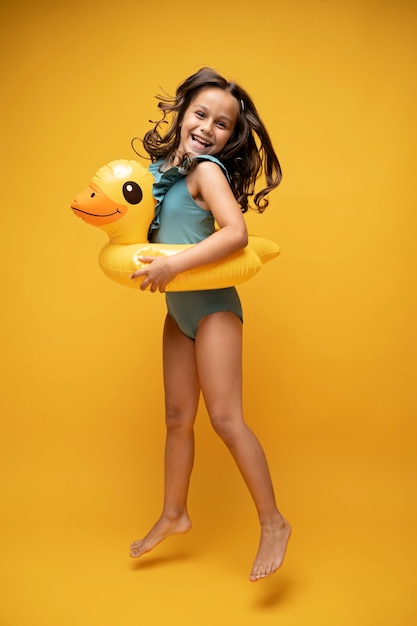 Free photo kids in bikini posing in studio