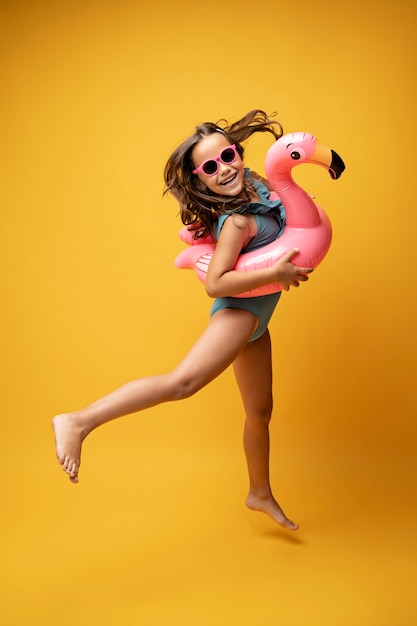 Free photo kids in bikini posing in studio