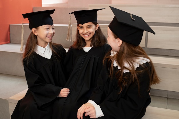 Free photo kids celebrating kindergarten graduation