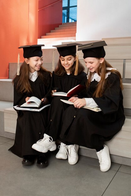 Kids celebrating kindergarten graduation