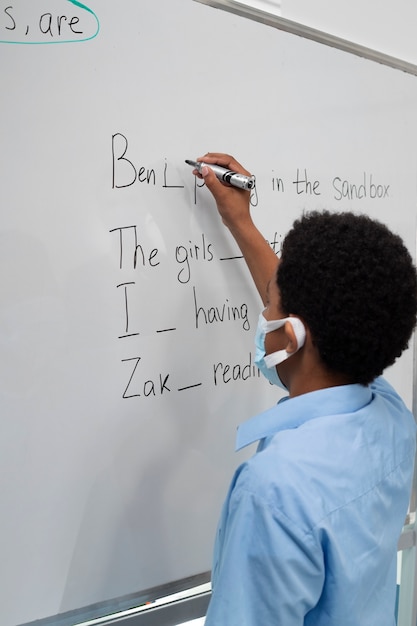 Kids in classroom taking english class