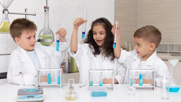 Kids doing a chemical experiment at school