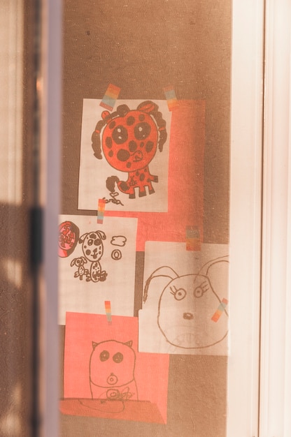 Kids drawings behind window