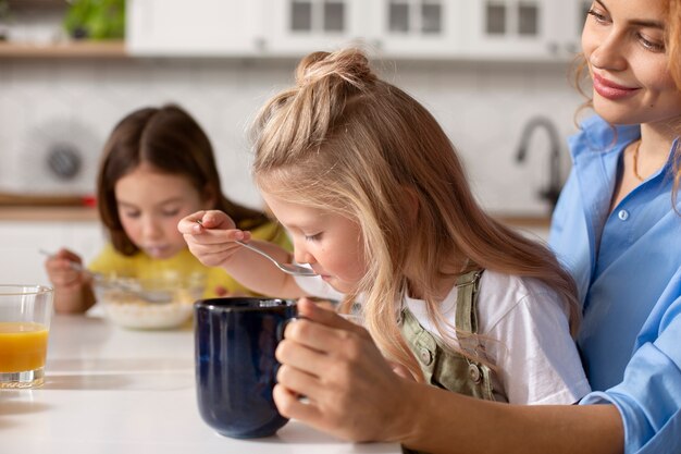 Kids eating together with their family