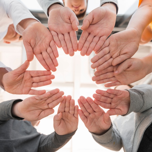 Kids hands making a circle