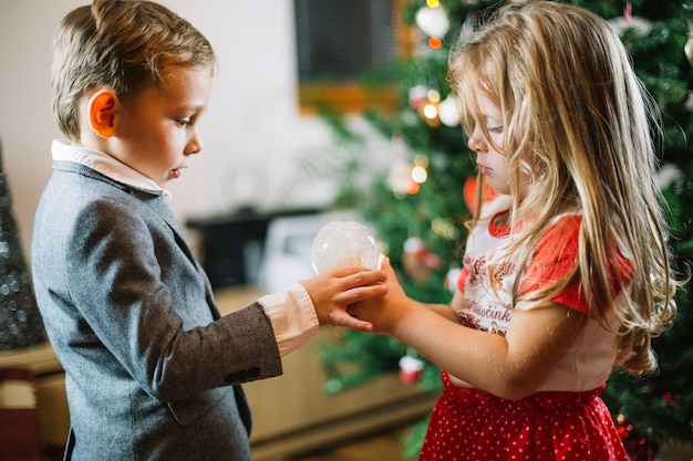 Kids holding light bulb