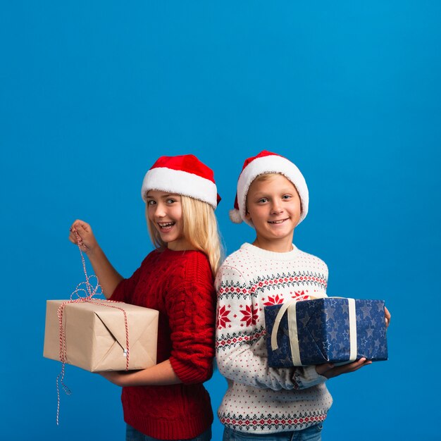 Kids holding presents copy space