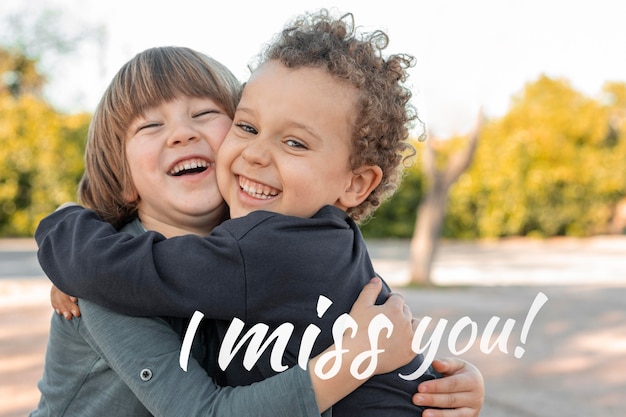 Kids hugging with an i miss you message