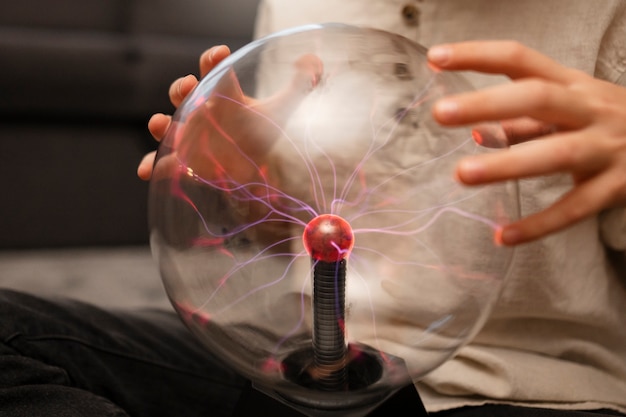 Kids interacting with a plasma ball