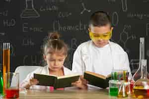 Free photo kids in laboratory doing experiments