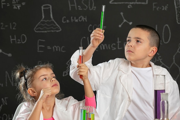 Kids in laboratory doing experiments