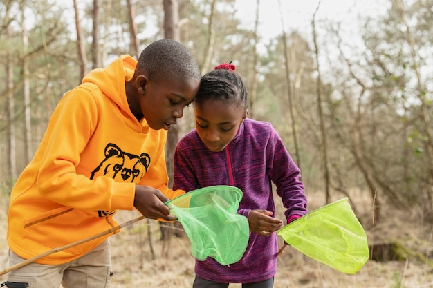 Kids looking through their fishing nets