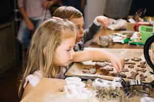 Free photo kids making gingerbread