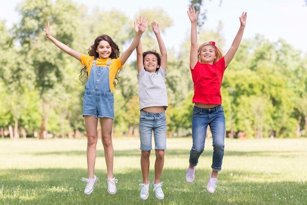 Kids in park jumping