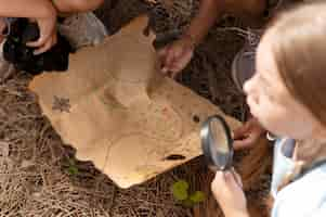 Free photo kids participating in a treasure hunt