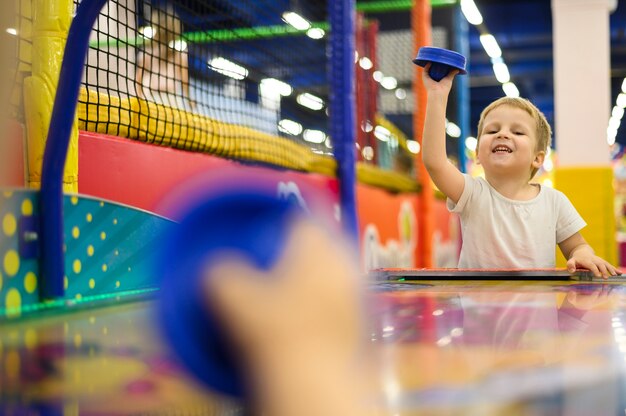 kids playing air flow hockey
