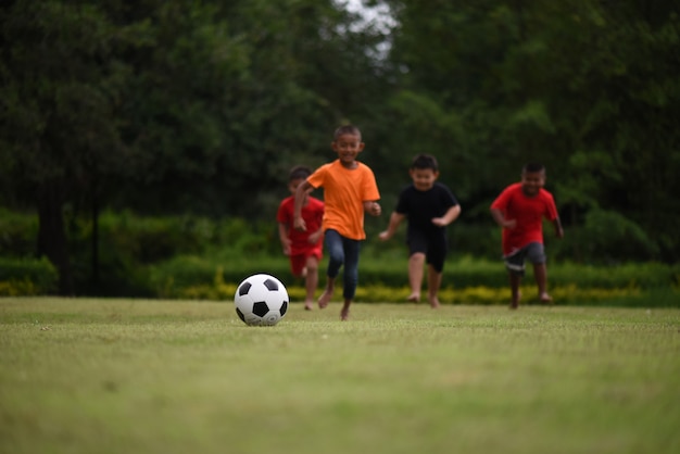 Free photo kids playing soccer football