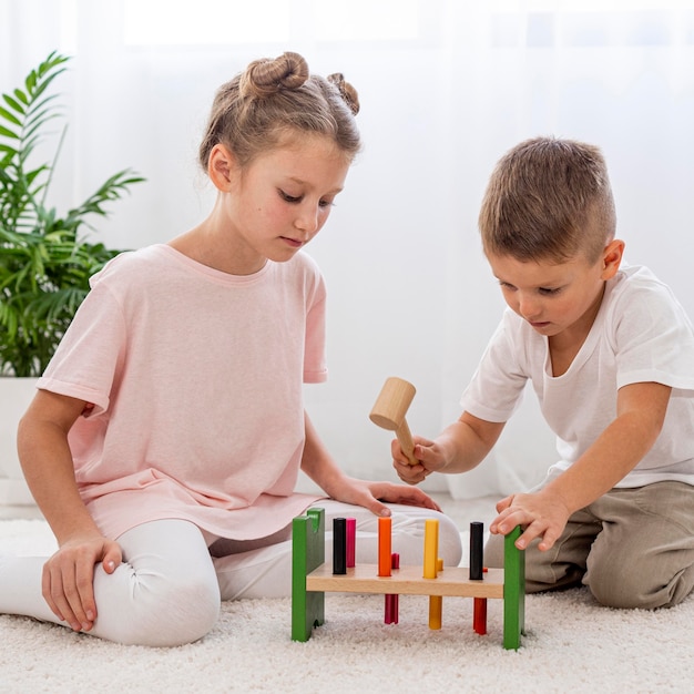 Free photo kids playing with colorful game