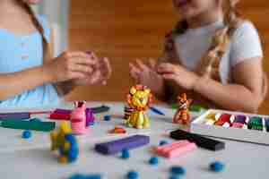 Free photo kids playing with play dough