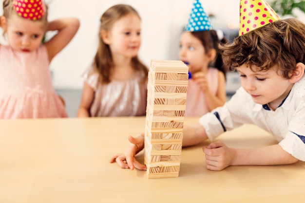 Kids playing wooden game