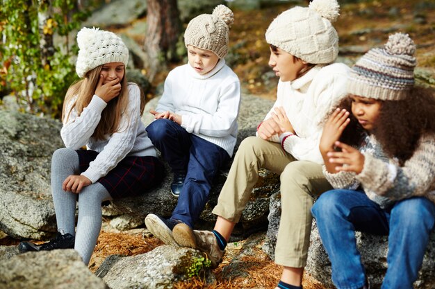 Kids Resting in Sunny Autumn  Forest