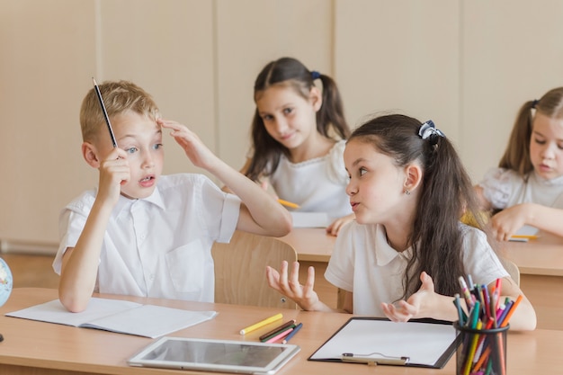 Free photo kids speaking during lesson