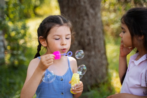 Kids spending time outdoors in a rural area enjoying childhood