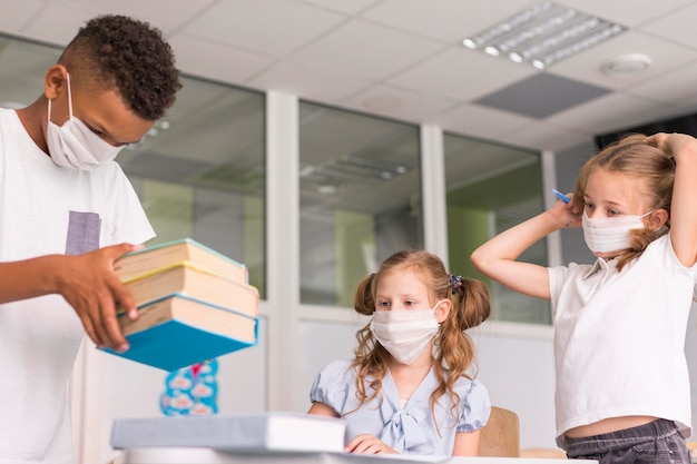 Kids spending time together in class during pandemic time
