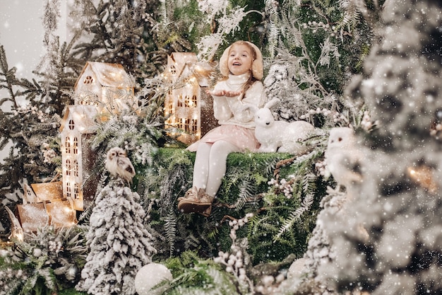 Kids standing on the upper level of Christmas decoration