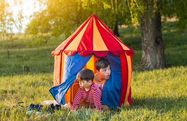 Free photo kids in tent outdoors