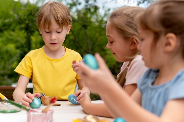 Kids with painted eggs close up