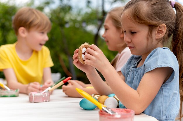 Kids with painted eggs medium shot
