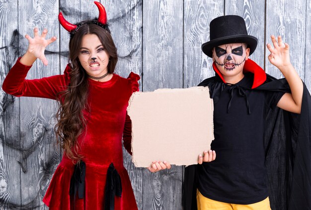 Kids with painted faces ready for halloween