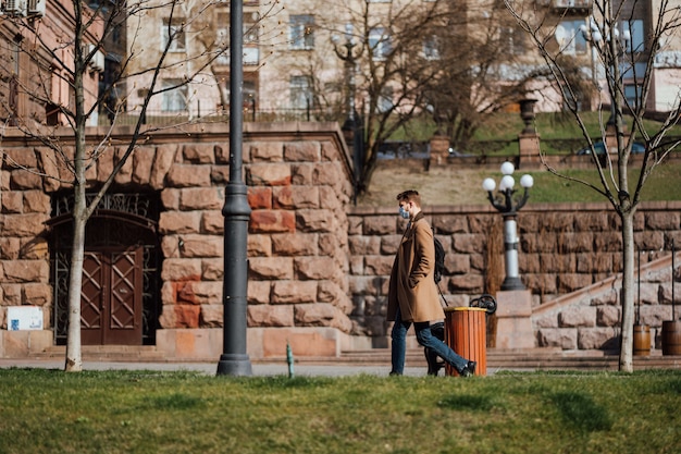 Kiev, Ukraine, March 28, 2020, Ukrainian people at facial protective masks at almost empty street, quarantine time at Ukraine,