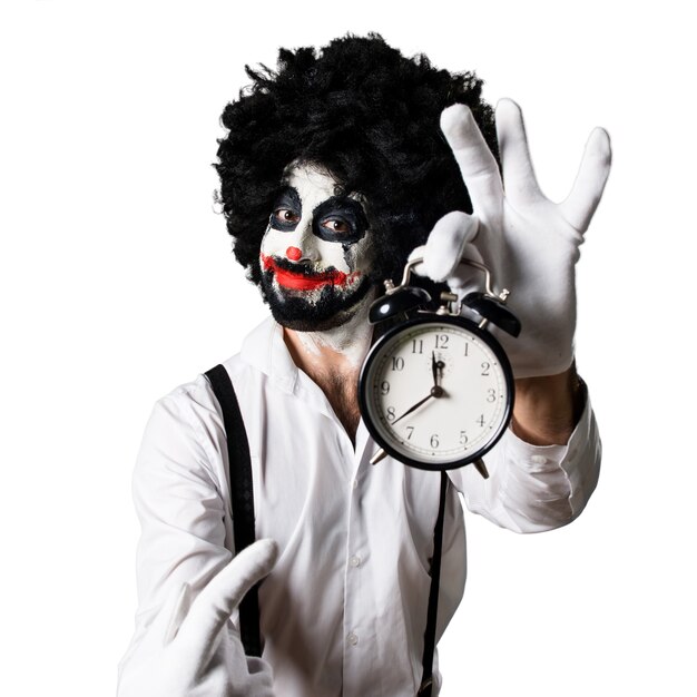 Killer clown holding vintage clock