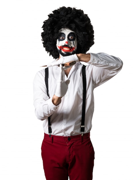 Killer clown making time out gesture