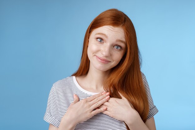 Kind tender sincere cute caucasian redhead girl melting go speechless heartwarming precious moment touched moving gift received compliment smiling delighted press palms grateful, thankful.